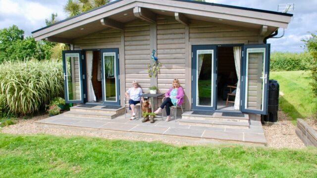Women sitting outside annex